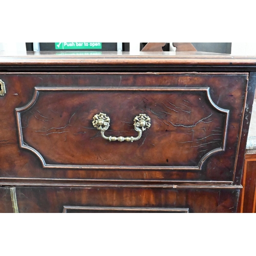 146 - A Regency mahogany secretaire with fitted interior and panelled cupboards raised on bracket feet, 12... 