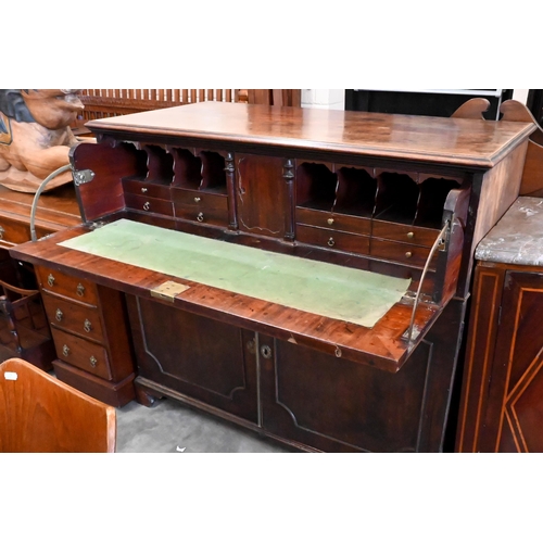 146 - A Regency mahogany secretaire with fitted interior and panelled cupboards raised on bracket feet, 12... 