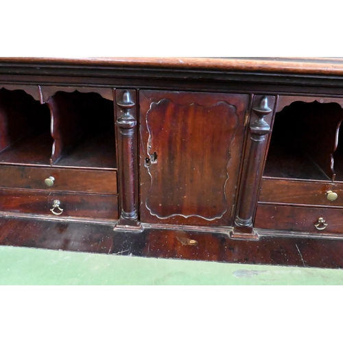 146 - A Regency mahogany secretaire with fitted interior and panelled cupboards raised on bracket feet, 12... 