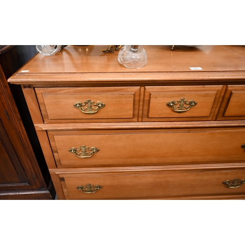 152 - A Georgian style chest of three long drawers on shaped bracket feet, 110 cm wide x 48 cm deep x 84 c... 