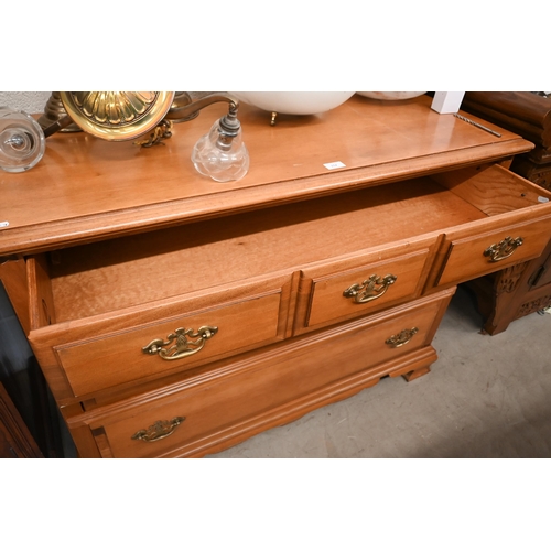 152 - A Georgian style chest of three long drawers on shaped bracket feet, 110 cm wide x 48 cm deep x 84 c... 