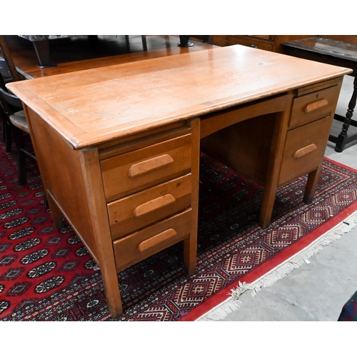 158 - A mid-century light oak kneehole desk, 136 x 76 x 76 cm