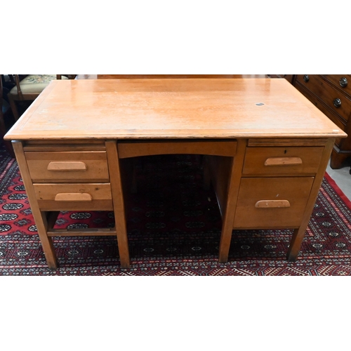 158 - A mid-century light oak kneehole desk, 136 x 76 x 76 cm