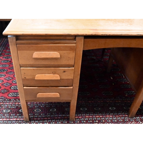 158 - A mid-century light oak kneehole desk, 136 x 76 x 76 cm