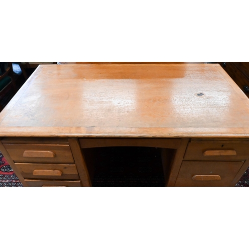 158 - A mid-century light oak kneehole desk, 136 x 76 x 76 cm