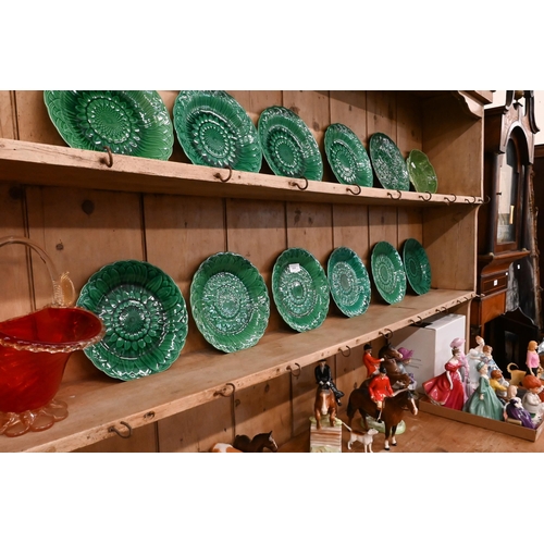 161 - A large Victorian stripped pine dresser with plate rack over three drawers and panelled cupboards (a... 