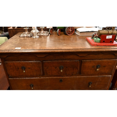 167 - An 18th century oak chest of three short over three long graduating drawers on shaped bracket feet, ... 