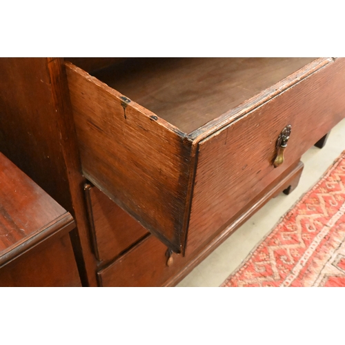 167 - An 18th century oak chest of three short over three long graduating drawers on shaped bracket feet, ... 