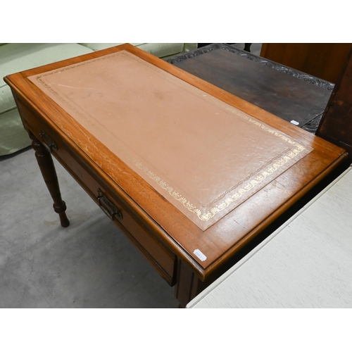 168 - # An Edwardian writing table with gilt tooled tan leather top and frieze drawer raised on turned sup... 