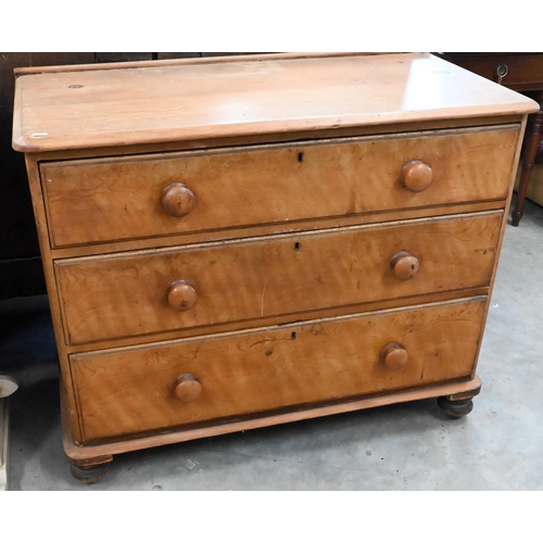 169 - A Georgian birch and pine chest of three long drawers with turned handles and bun feet, 100 x 50 x 8... 