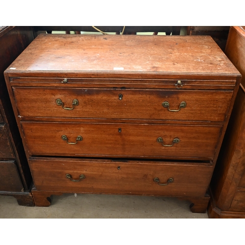 177 - A George III mahogany chest of three long graduating drawers below brush slide, raised on shaped bra... 