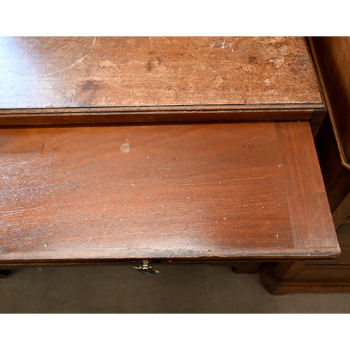 177 - A George III mahogany chest of three long graduating drawers below brush slide, raised on shaped bra... 