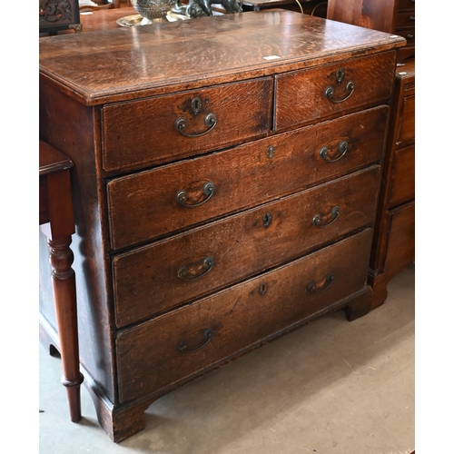 178 - An antique 18th century oak chest of two short over three long drawers raised on bracket feet, 96 cm... 