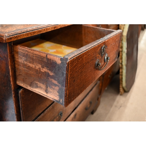 178 - An antique 18th century oak chest of two short over three long drawers raised on bracket feet, 96 cm... 