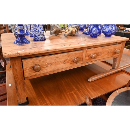 180 - A rustic waxed pine rectangular coffee table with two drawers, 138 x 86 x 45 cm