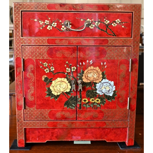 186 - A modern Chinese red lacquered side cabinet with gilt and polychrome floral decoration, 50 x 36 x 62... 