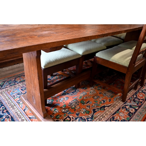 188 - An antique provincial refectory dining table on twin trestle supports united by jointed stretcher, 2... 