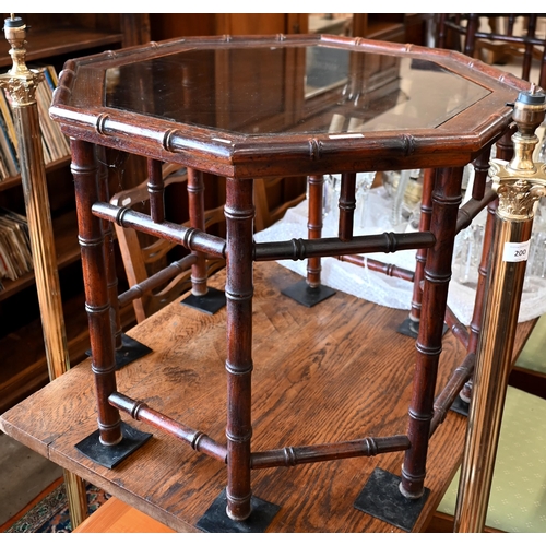 189 - A pair of simulated bamboo stained hardwood octagonal side/coffee tables with inset glass top, 65 cm... 