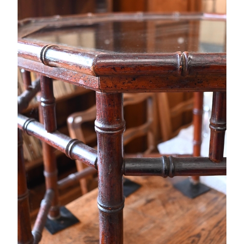 189 - A pair of simulated bamboo stained hardwood octagonal side/coffee tables with inset glass top, 65 cm... 