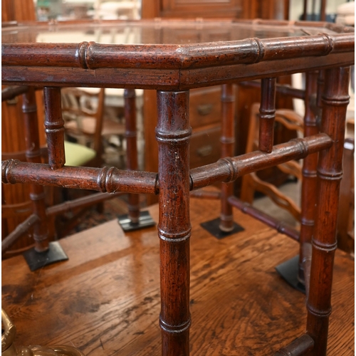 189 - A pair of simulated bamboo stained hardwood octagonal side/coffee tables with inset glass top, 65 cm... 