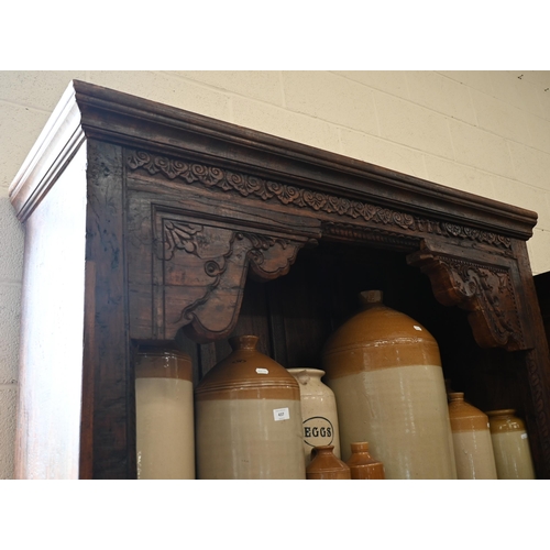 193 - A large Indian stained hardwood Havali door frame open bookcase with four shelves (very heavy), 140 ... 