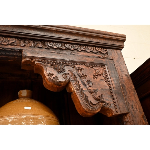 193 - A large Indian stained hardwood Havali door frame open bookcase with four shelves (very heavy), 140 ... 