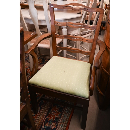 194 - Eight mahogany Georgian style wavy ladderback dining chairs with green patterned fabric pad seats (7... 