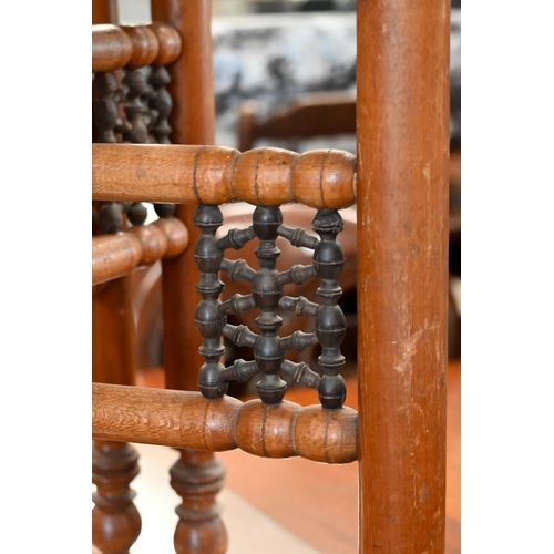 206 - A Middle Eastern engraved brass tray-top table on folding hardwood stand, 66 cm diam x 56 cm high