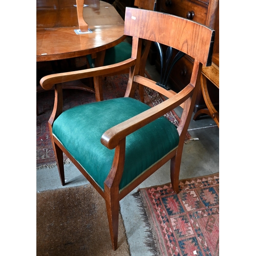 207 - # A Biedermeier circular fruitwood table, the top extending to accept one associated leaf to/w a set... 