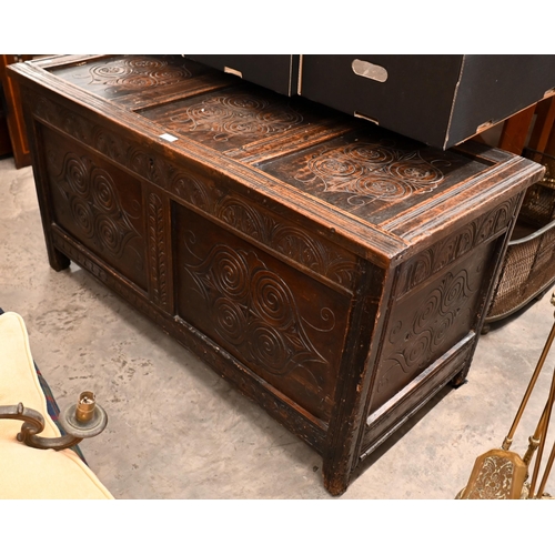 213 - An antique carved oak coffer/blanket chest of panelled construction, 126 cm wide x 58 cm deep x 65 c... 