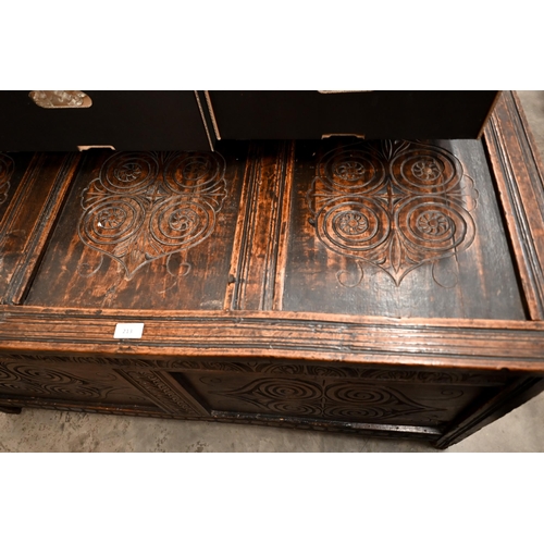 213 - An antique carved oak coffer/blanket chest of panelled construction, 126 cm wide x 58 cm deep x 65 c... 