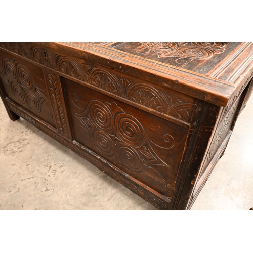 213 - An antique carved oak coffer/blanket chest of panelled construction, 126 cm wide x 58 cm deep x 65 c... 