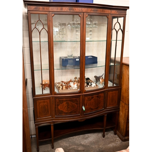 220 - An Edwardian Sheraton revival inlaid mahogany display cabinet on tapering square supports with spade... 