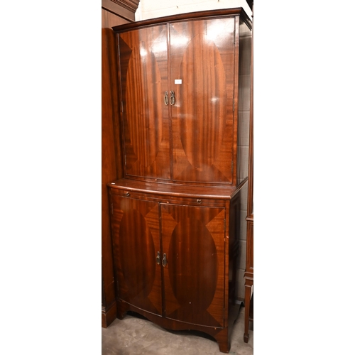 222 - # A mahogany bowfront drinks cabinet with fitted interior and central pull-out slide, 80 x 50 x 186 ... 