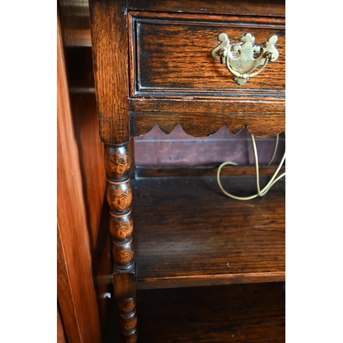 225 - An early 20th century oak buffet with single drawer and open shelves and bobbin turned supports, 92 ... 