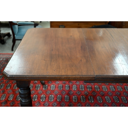 228 - An Edwardian mahogany extending dining table, wind-out canted rectangular top with single leaf on tu... 