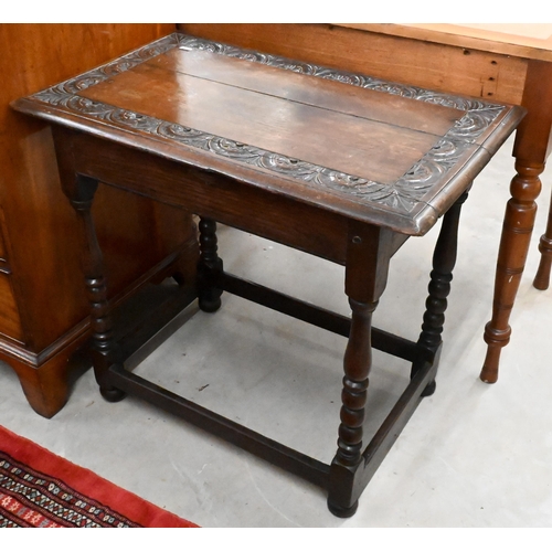 231 - A lunette carved oak side table with turned supports united by stretchers, 75 x 46 x 66 cm high