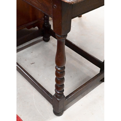 231 - A lunette carved oak side table with turned supports united by stretchers, 75 x 46 x 66 cm high