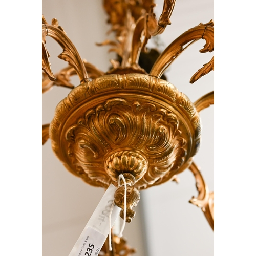 235 - A Continental two-tier gilt metal chandelier/electrolier of foliate nine branch design, 55 cm high