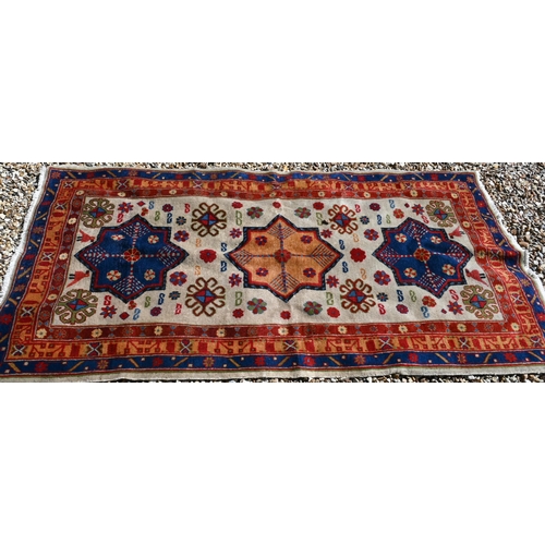 245 - A Caucasian geometric design blue ground runner, 323 x 70 cm to/w a Turkish star medallion cream gro... 