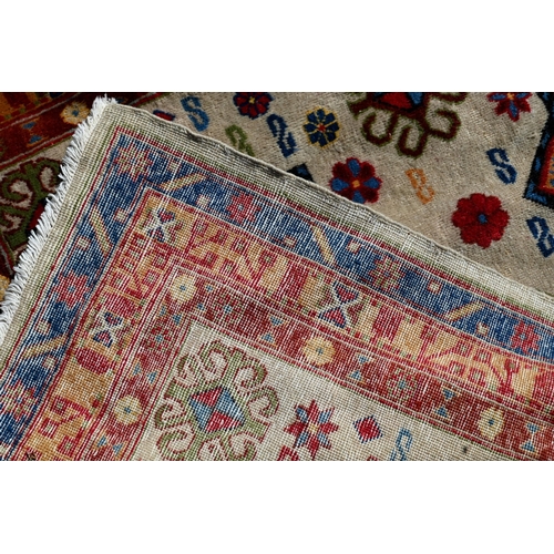 245 - A Caucasian geometric design blue ground runner, 323 x 70 cm to/w a Turkish star medallion cream gro... 