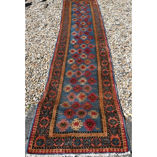 245 - A Caucasian geometric design blue ground runner, 323 x 70 cm to/w a Turkish star medallion cream gro... 