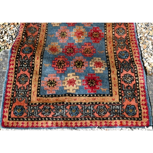 245 - A Caucasian geometric design blue ground runner, 323 x 70 cm to/w a Turkish star medallion cream gro... 