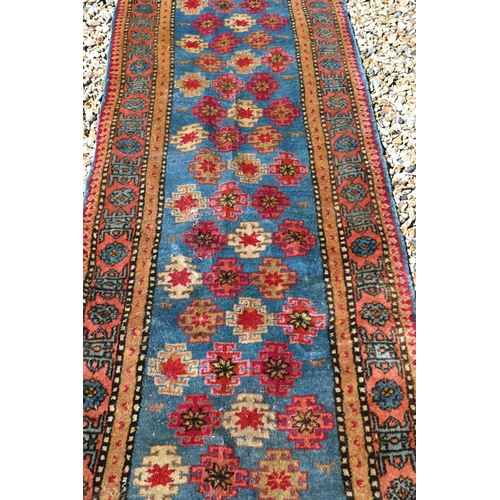 245 - A Caucasian geometric design blue ground runner, 323 x 70 cm to/w a Turkish star medallion cream gro... 