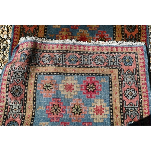 245 - A Caucasian geometric design blue ground runner, 323 x 70 cm to/w a Turkish star medallion cream gro... 