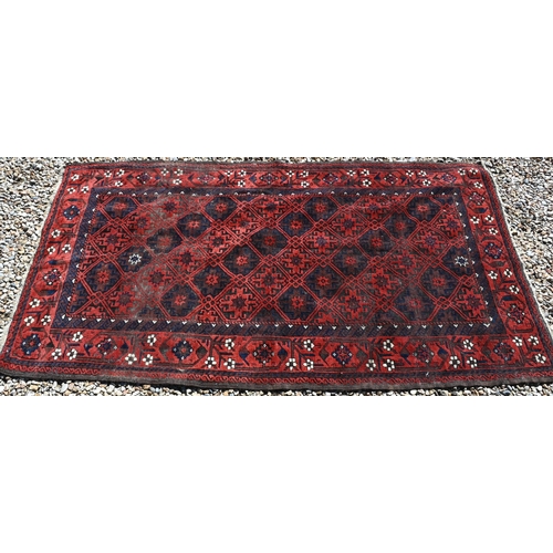 254 - Persian Balouchi rug, brown/red ground with repeating lattice design, 198 x 108 cm