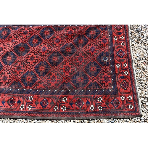 254 - Persian Balouchi rug, brown/red ground with repeating lattice design, 198 x 108 cm