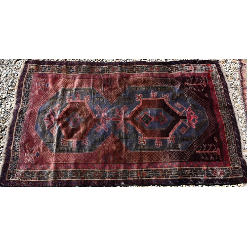 257 - A Persian Baluchi rug, double medallion on blue/brown ground, 167 x 98 cm to/w a Persian Hamadan rug... 