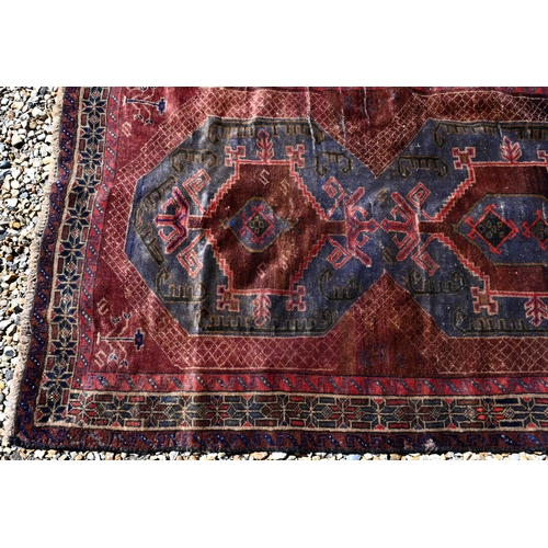 257 - A Persian Baluchi rug, double medallion on blue/brown ground, 167 x 98 cm to/w a Persian Hamadan rug... 