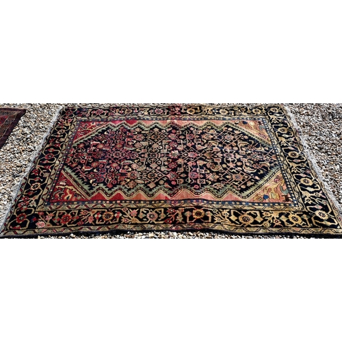 257 - A Persian Baluchi rug, double medallion on blue/brown ground, 167 x 98 cm to/w a Persian Hamadan rug... 